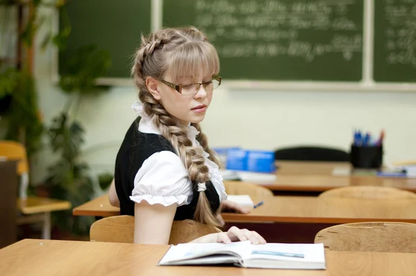 Schoolgirl on board background — Stock Photo, Image