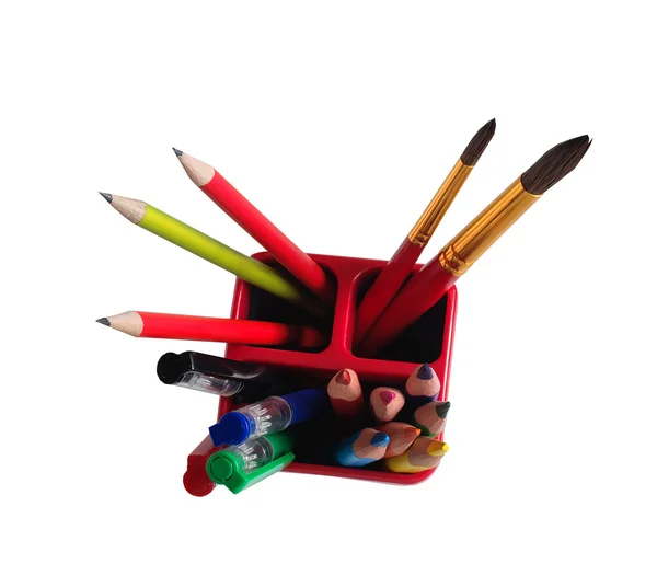 School Accessories: pencils, brushes, pens in a glass on a white — Stock Photo, Image