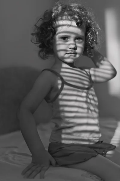 black and  white portrait of a beautiful young girl with shadow