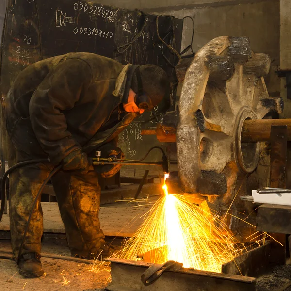 Lasser aan het werk. Stockfoto