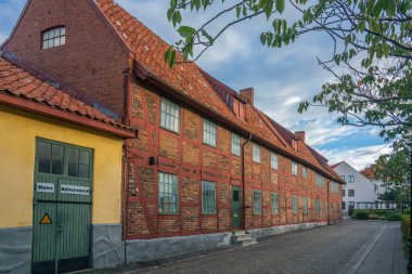 Ystad, Sweden - 6 Sep, 2022: Old half timbered building that houses smaller businesses in a smaller town, southern Sweden.