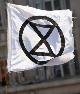 London, UK. 19th April 2019. One of the many posters & banners seen at the Extinction Rebellion demonstration, at Oxford Circus, London, in protest of world climate breakdown and ecological collapse.