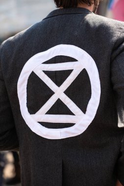 London, UK. 19th April 2019. One of the many posters & banners seen at the Extinction Rebellion demonstration, at Oxford Circus, London, in protest of world climate breakdown and ecological collapse.