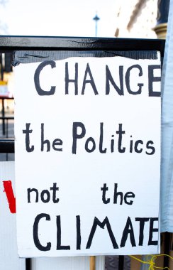 London, UK. 19th April 2019. One of the many signs seen at the Extinction Rebellion demonstration, at Parliament Square, London, in protest of world climate breakdown and ecological collapse.