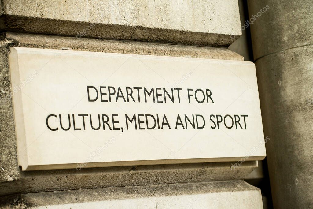 Close up of DEPARTMENT OF CULTURE, MEDIA AND SPORT stone sign on the exterior of government building in Whitehall, London, England. 