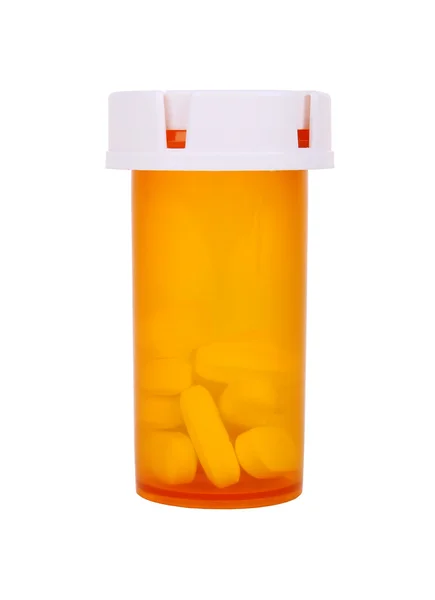 A medical pill bottle with a blank label for copy space and the bottle is isolated on a white background. — Stock Photo, Image