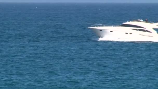 Large luxury motor yacht under way out at sea — Stock Video