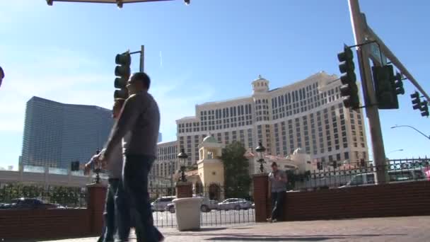 LAS VEGAS, NEVADA - CIRCA 2012: Las Vegas Boulevard Strip with many walking by on sunny day. — Stock Video