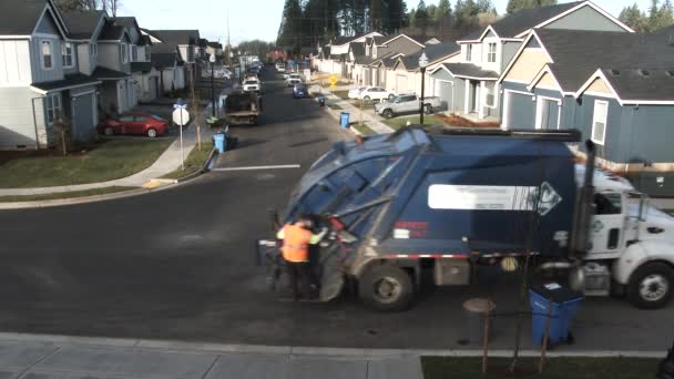 City Worker Stops Picks Trash Garbage Day Suburban Neighborhood — Stock Video