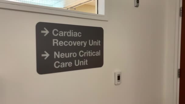 Interior Hospital Sign Reads Cardiac Recovery Unit Neuro Critical Care — Stock Video