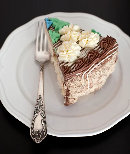 Kuchen mit buntem Sahnehäubchen — Stockfoto