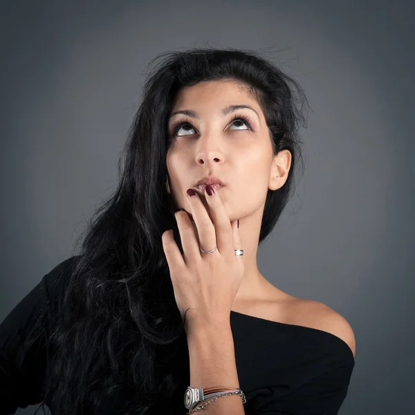 Woman close up portrait on dark background. Desperate expression — Stock Photo, Image