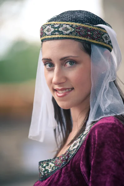 Beautiful girl wearing a burgundy medieval dress — Stock Photo, Image