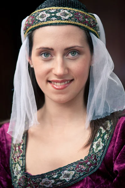 Beautiful girl wearing a burgundy medieval dress — Stock Photo, Image