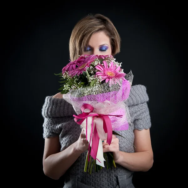 Portrait of beautiful girl with gerbera flowers bouquet and woolen dress — Stock Photo, Image