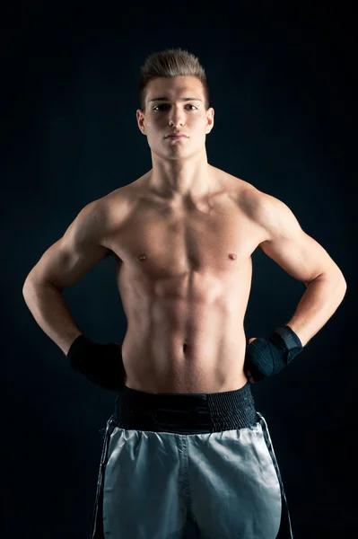 Sportsman boxer intense portrait in studio against black background — Stock Photo, Image