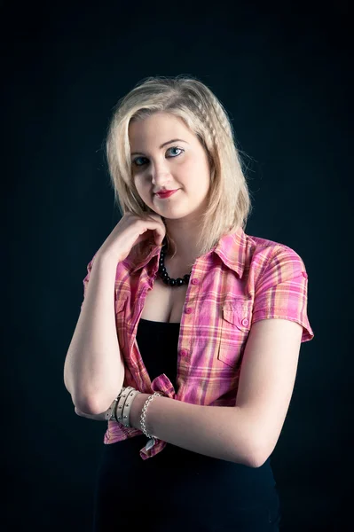 Portrait of blonde teenager girl on black background — Stock Photo, Image