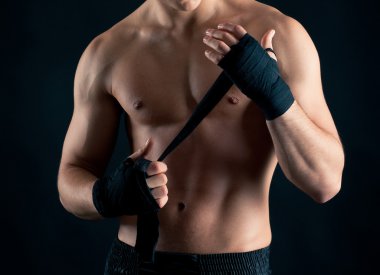 Sportsman boxer intense studio portrait against black background clipart
