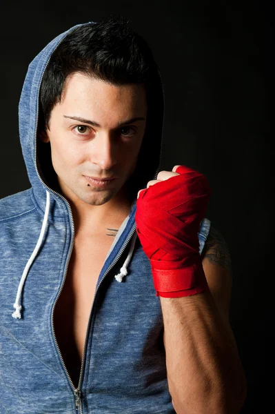 Portrait of young boxer on dark background — Stock Photo, Image