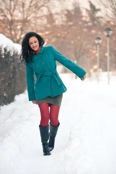 Portrait of beautiful girl in winter time walking in the snow — Stock Photo, Image