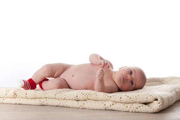 Newborn baby laying on a white blanket — Stock Photo, Image