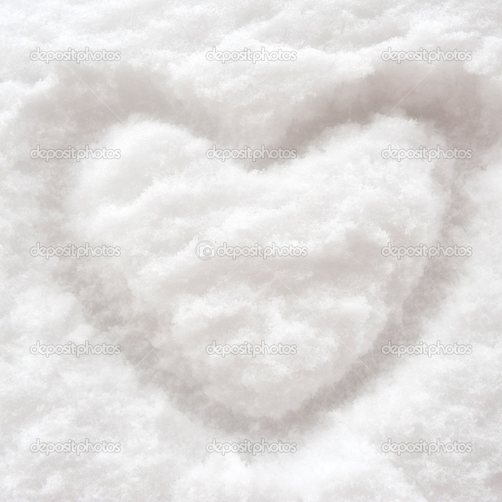 Heart symbol written on snow