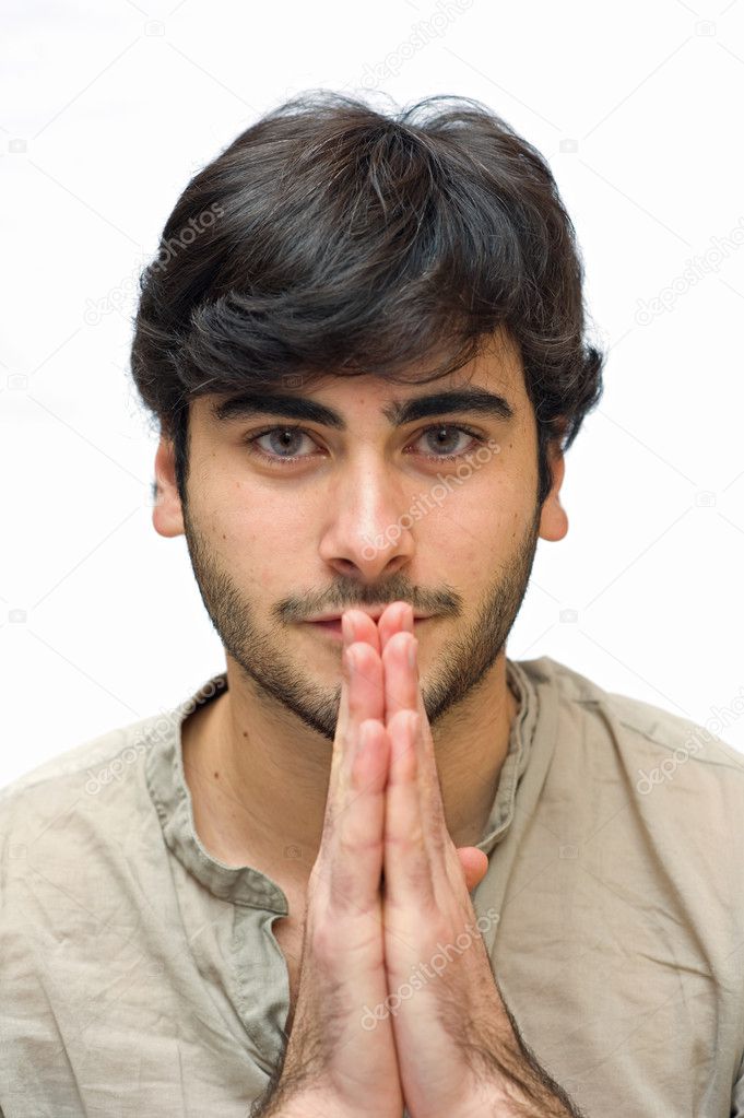 Happy casual man with hands together over white background
