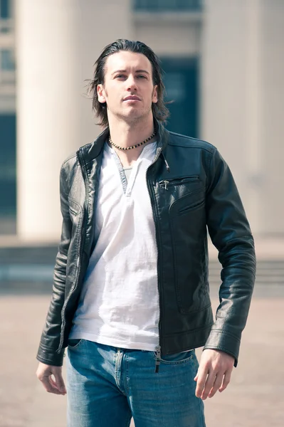 Young casual man portrait with leather jacket outdoors — Stock Photo, Image