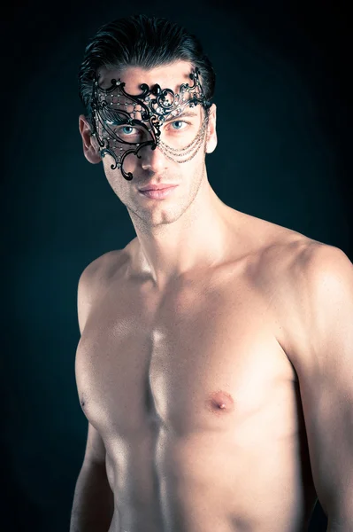 Portrait of young man shirtless against black background — Stock Photo, Image