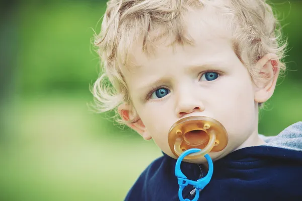 Small kid portrait with pacifier — Stock Photo, Image