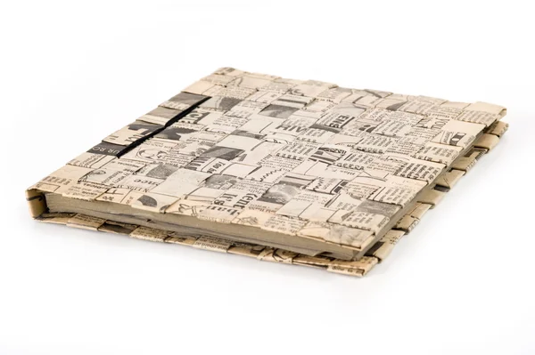 Diary book on white background. Cover made by old newspaper put together — Stock Photo, Image