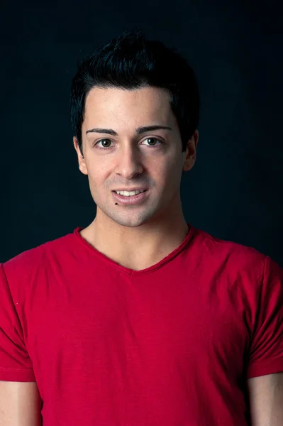 Man portrait with happy expression on dark background — Stock Photo, Image