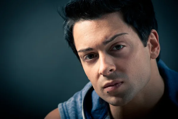 Portrait of handsome, confident man on dark background — Stock Photo, Image