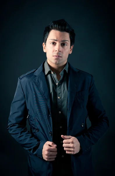 Portrait of handsome, confident man against dark background — Stock Photo, Image