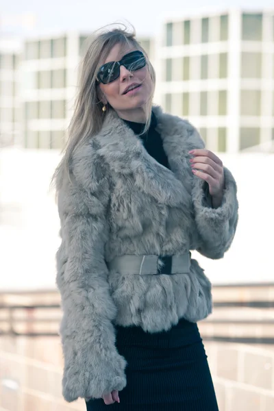 Portrait of young attractive woman with fur — Stock Photo, Image