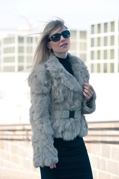 Portrait of young attractive woman with fur — Stock Photo, Image