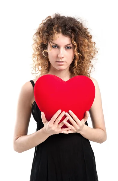Portrait of attractive young girl with heart against white background — Stock Photo, Image