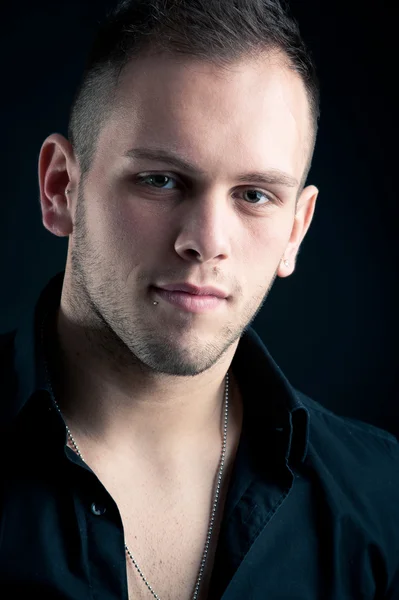 Young boy close up portrait against black background — Stock Photo, Image