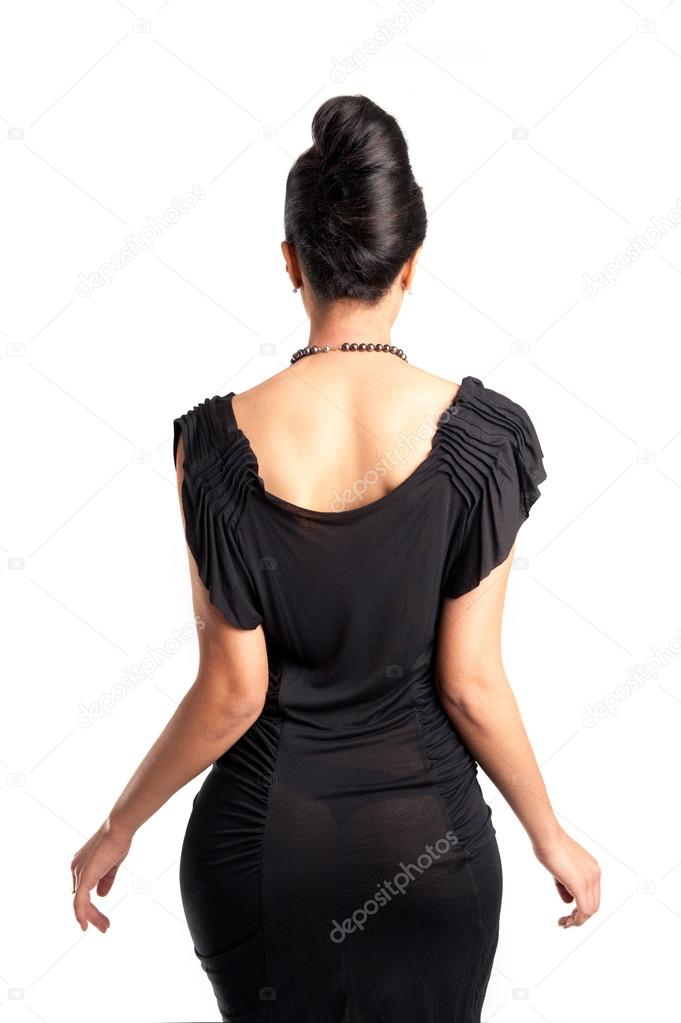 Elegant woman in black dress, beck view against white background
