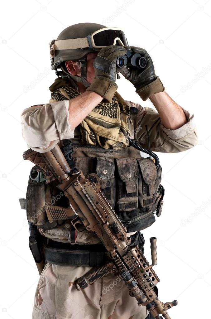 Soldier with binoculars against white background