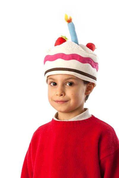 Ребенок в маске торта на белом фоне — стоковое фото