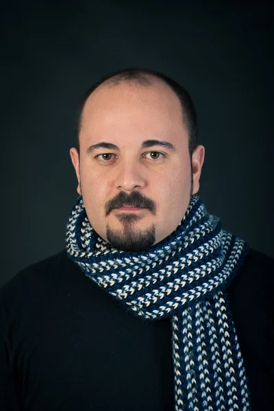 Man portrait with confident expression on dark background — Stock Photo, Image