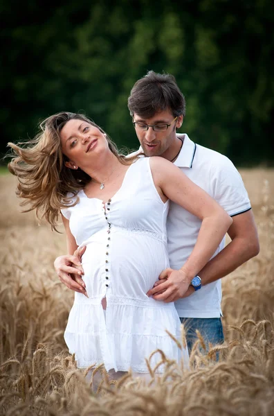 Romantic couple portrait in a wheat field — Stock Photo, Image