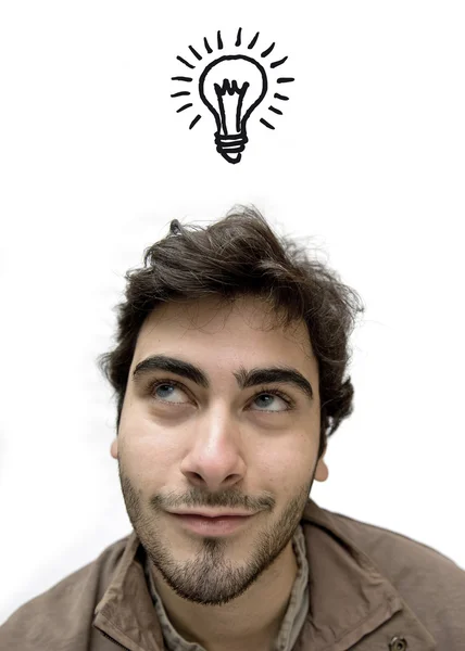 Happy casual man looking up over white background having an idea — Stock Photo, Image