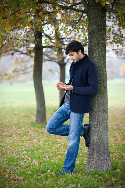 Intimate portrait of man outside in a park — Stock Photo, Image