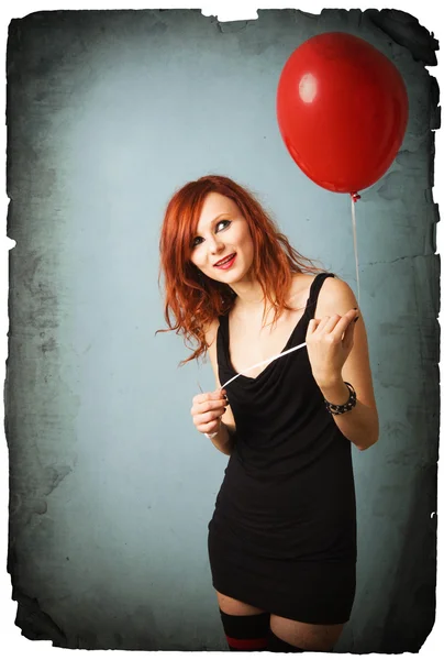 Vintage portrait of beautiful redhead caucasian girl with heart balloon — Stock Photo, Image