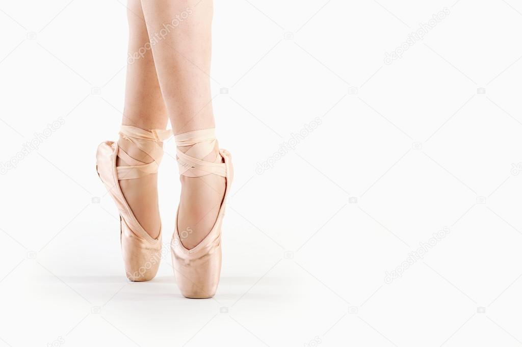 Feet close up of dancer isolated on white background
