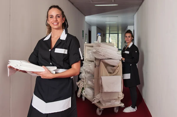 Two chambermaid women cleaning in a hotel — Stock Photo, Image