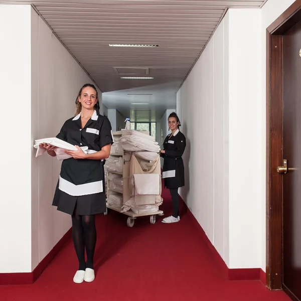 Two chambermaid women cleaning in a hotel — Stock Photo, Image