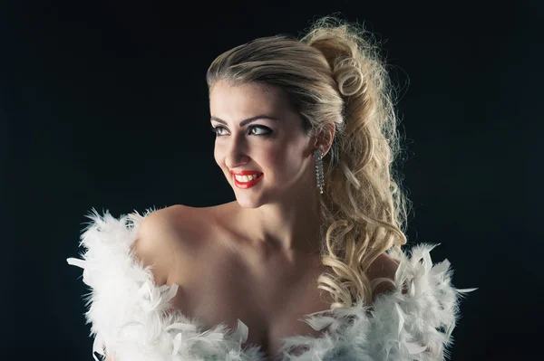Beautiful blonde woman close up portrait with white ostrich feat — Stock Photo, Image